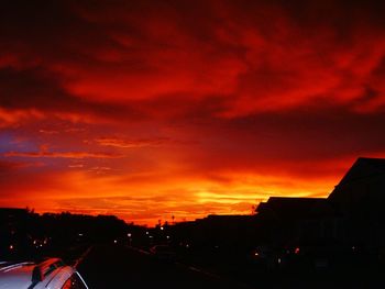 Cars on road at sunset