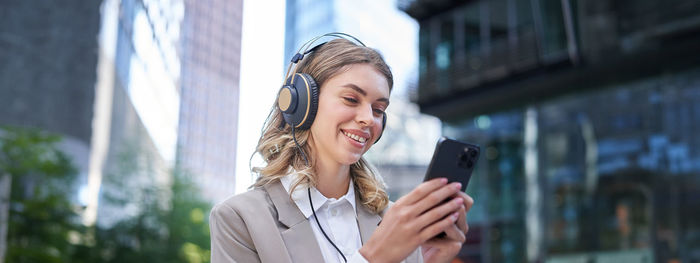 Young woman using mobile phone