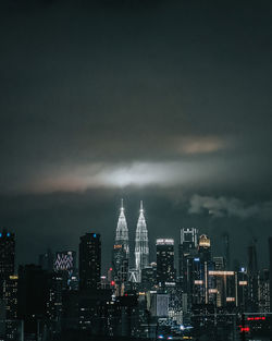 Kuala lumpur twin towers lighting up the night sky