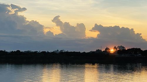 Scenic view of lake against sky during sunset
