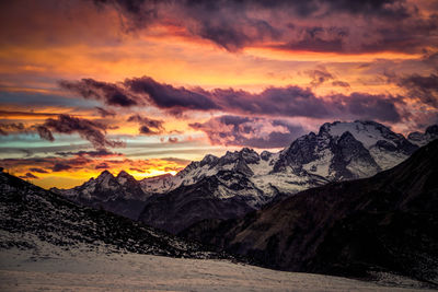 Scenic view of mountains against dramatic sky