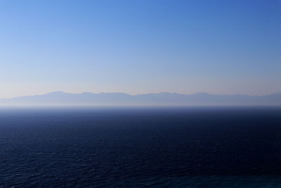 Sea with mountains background