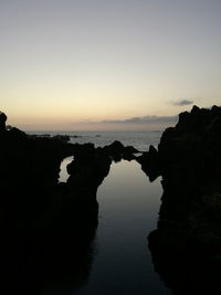 Scenic view of sea against clear sky during sunset