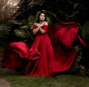 Portrait of woman standing in forest