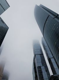 Low angle view of modern buildings against sky