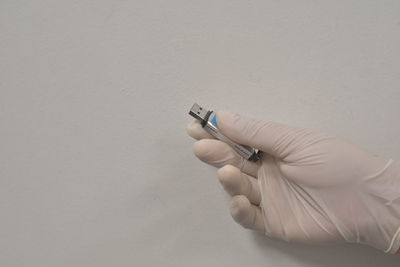 High angle view of person hand against white background