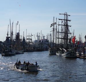 Boats in water against sky