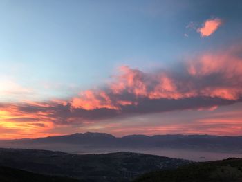 Scenic view of mountains against sky during sunset