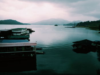 Scenic view of calm lake against mountain range