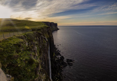 Kilt rock and mealt falls at sunset on the isle of skye, scottish highlands, uk