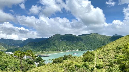 Scenic view of lake and mountains against sky