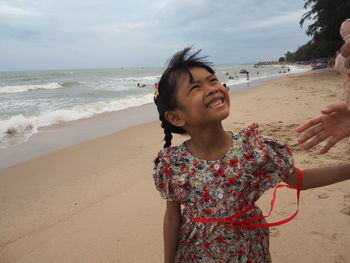 Portrait of happy girl on beach