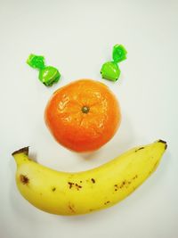 Close-up of fruits against white background