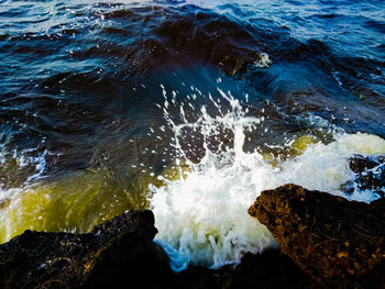 Sea waves splashing on rocks