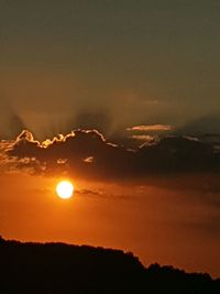 Scenic view of silhouette mountains against sky during sunset