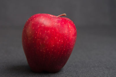 Close-up of apple against black background