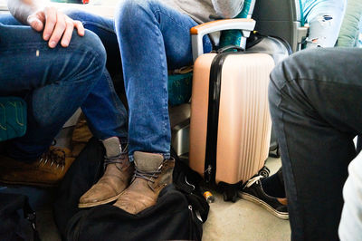 Low section of women sitting on floor