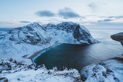 Scenic view of frozen lake against sky