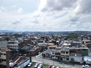 High angle view of buildings in city against sky