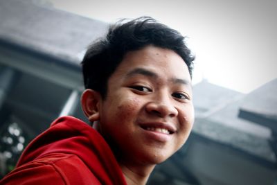 Close-up portrait of smiling young man