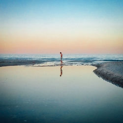 Scenic view of sea at sunset