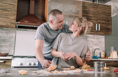 Man and woman having food at home