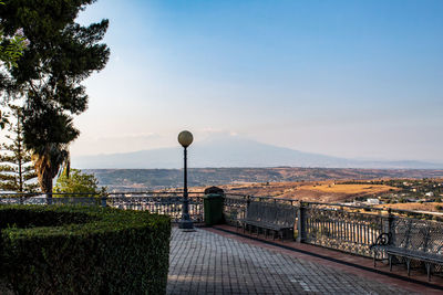 Scenic view of landscape and etna volcano against sky