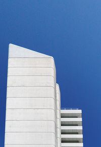 Low angle view of building against clear blue sky