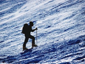 Woman standing on snow covered landscape