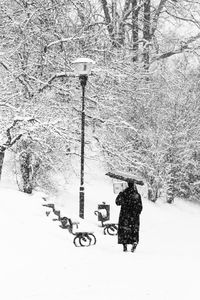 People walking on snow covered landscape