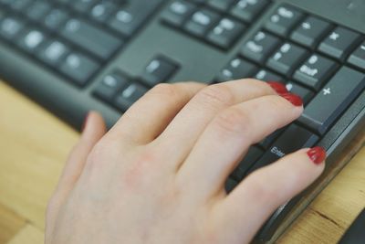 Midsection of person using mobile phone