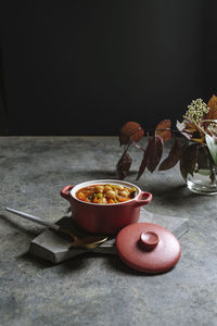 Close-up of breakfast on table against black background