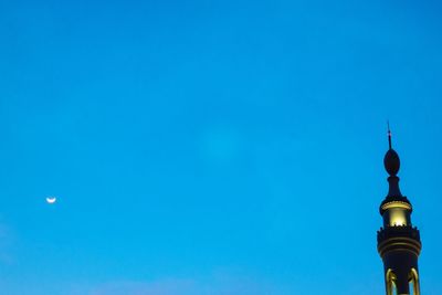 Low angle view of building against blue sky