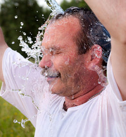 Man pouring water in the heat