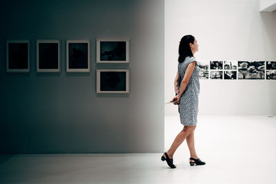 Young woman standing on floor