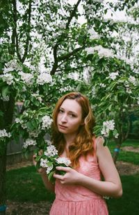 Portrait of young woman looking away