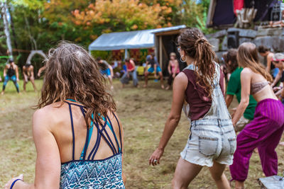 Rear view of people enjoying music festival