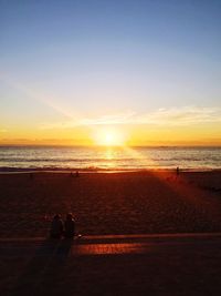 Scenic view of sea at sunset