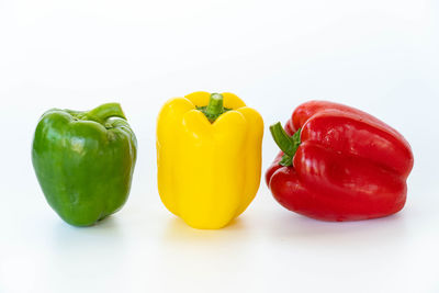 Close-up of bell peppers against white background