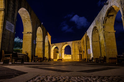 Low angle view of historical building at night