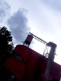 Low angle view of factory against sky