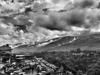 Townscape against cloudy sky