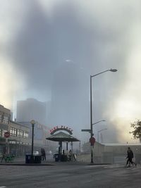 People on street in foggy weather