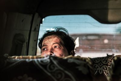 Portrait of man in car