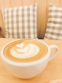 Close-up of cappuccino on table