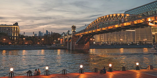 Bridge over river at dusk