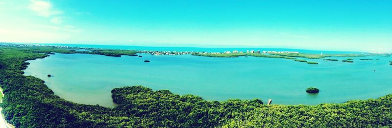 Scenic view of sea against blue sky