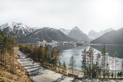 Scenic view of lake and mountains against sky