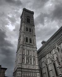 Low angle view of clock tower against sky