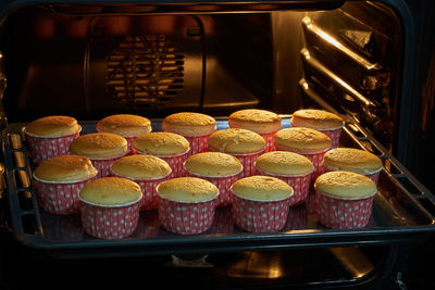 High angle view of cupcakes baking in oven